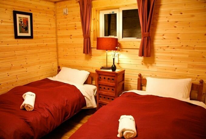 Imagen de la habitación del Hotel Morino Lodge Chalets. Foto 28