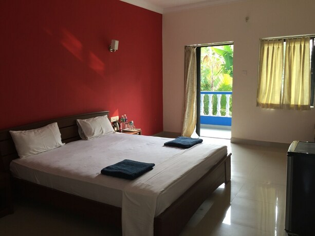 Imagen de la habitación del Hotel Morjim Coco Palms Resort. Foto 17