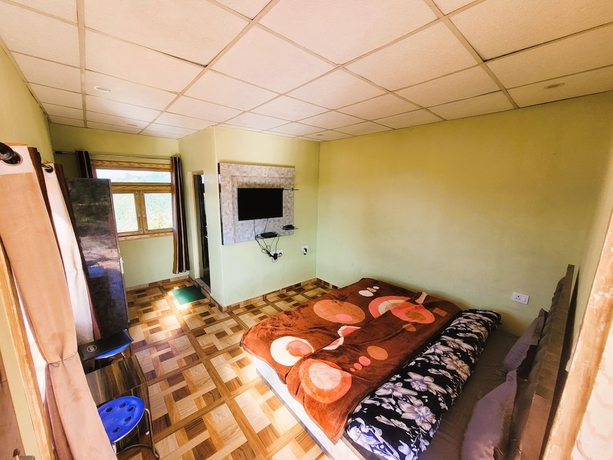 Imagen de la habitación del Hotel Morning Breeze Homestay Kanatal. Foto 5