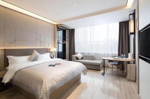 Imagen de la habitación del Hotel Morning, Wuhan Jinyin Lake Garden Expo Garden Yuya Yinhu City. Foto 7