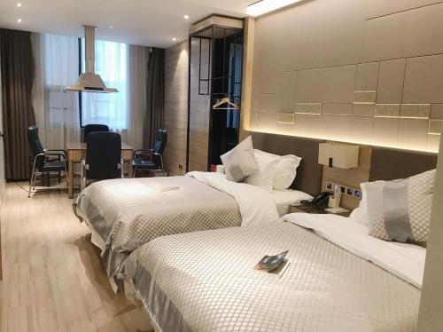 Imagen de la habitación del Hotel Morning, Wuhan Jinyin Lake Garden Expo Garden Yuya Yinhu City. Foto 11