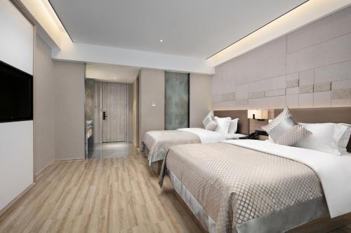 Imagen de la habitación del Hotel Morning, Xiangxiang. Foto 15