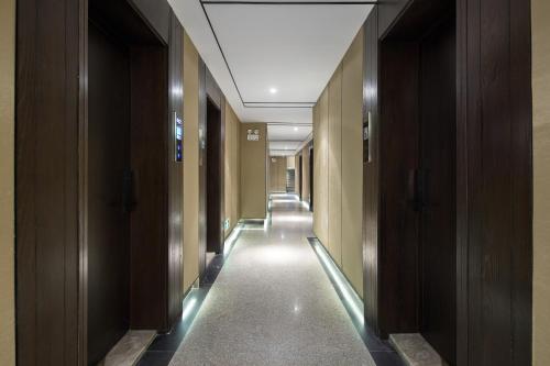 Imagen de la habitación del Hotel Morninginn, Phoenix Ancient City Tuojiang. Foto 11