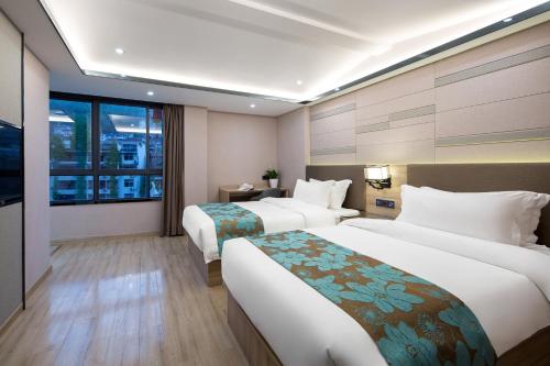 Imagen de la habitación del Hotel Morninginn, Phoenix Ancient City Tuojiang. Foto 14