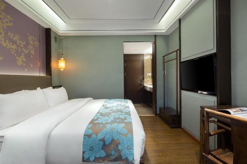 Imagen de la habitación del Hotel Morninginn, Phoenix Ancient City Tuojiang. Foto 15