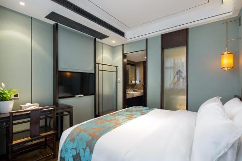 Imagen de la habitación del Hotel Morninginn, Phoenix Ancient City Tuojiang. Foto 16