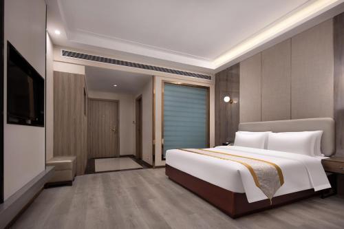 Imagen de la habitación del Hotel Morninginn, Xingsha Huiyi City. Foto 11