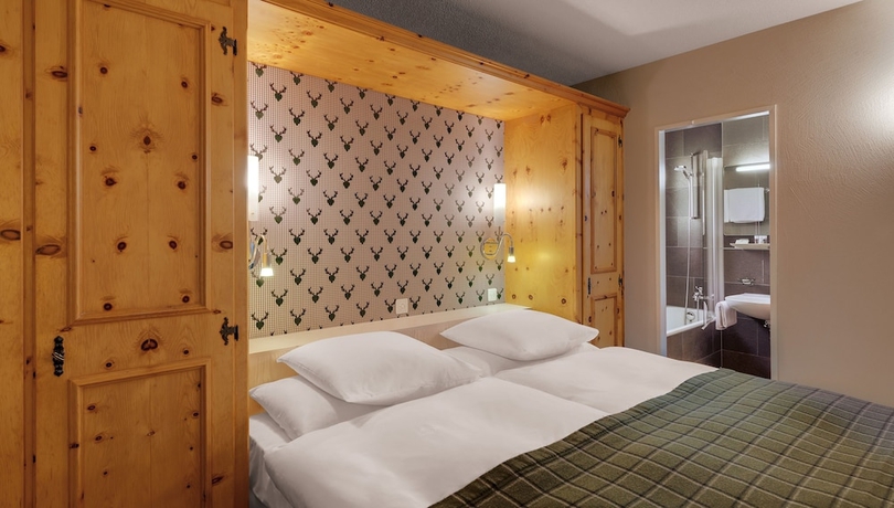 Imagen de la habitación del Hotel Morosani Posthotel Davos. Foto 17