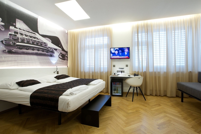 Imagen de la habitación del Hotel Mosaic House Design. Foto 7