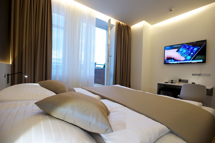 Imagen de la habitación del Hotel Mosaic House Design. Foto 10