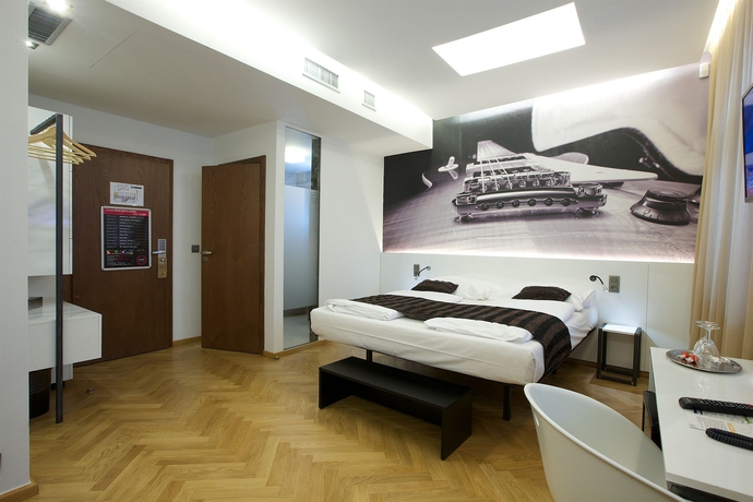 Imagen de la habitación del Hotel Mosaic House Design. Foto 11