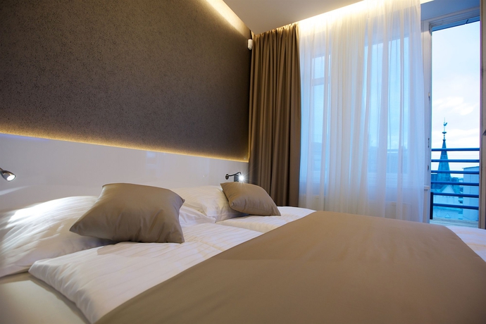 Imagen de la habitación del Hotel Mosaic House Design. Foto 12