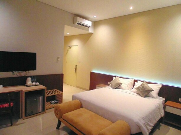 Imagen de la habitación del Hotel Moscha Surabaya City Center. Foto 14