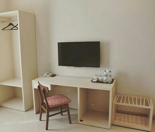 Imagen de la habitación del Hotel Moscha Surabaya City Center. Foto 16