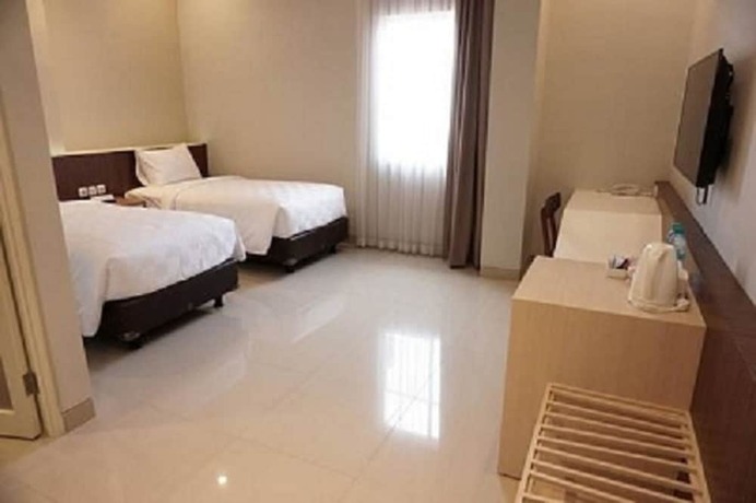 Imagen de la habitación del Hotel Moscha Surabaya City Center. Foto 20