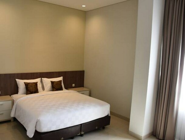 Imagen de la habitación del Hotel Moscha Surabaya City Center. Foto 23