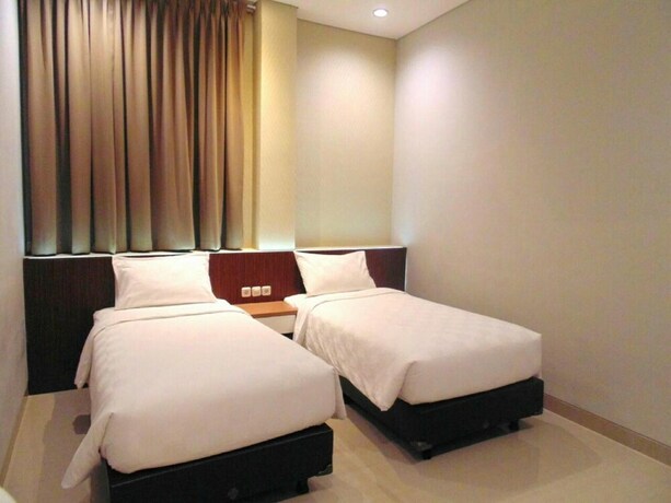 Imagen de la habitación del Hotel Moscha Surabaya City Center. Foto 28