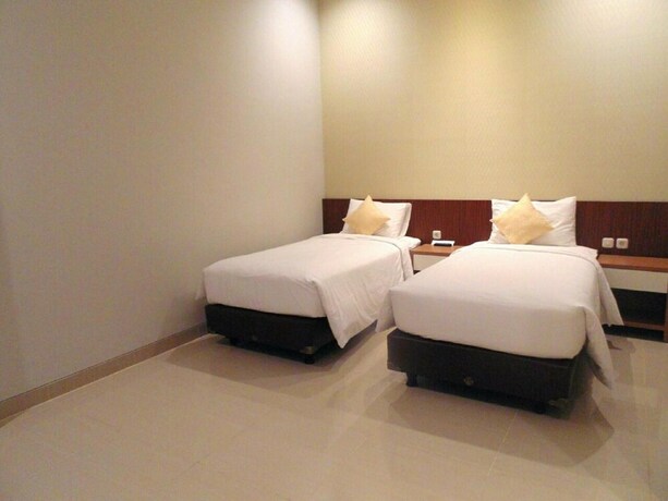Imagen de la habitación del Hotel Moscha Surabaya City Center. Foto 30