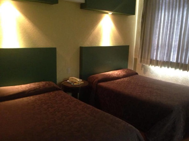 Imagen de la habitación del Hotel Motel La Fortuna. Foto 9