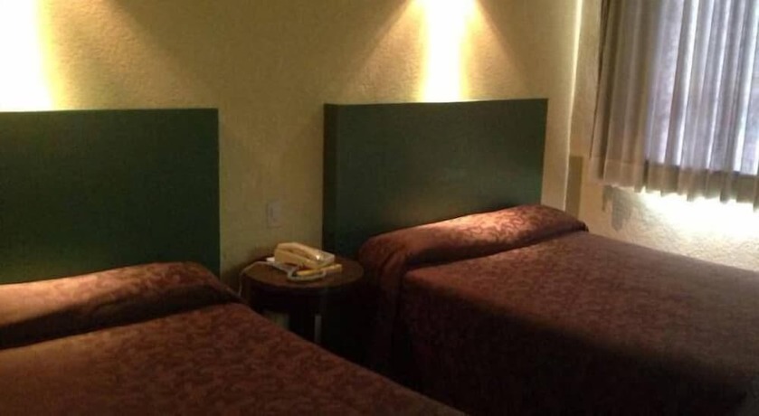 Imagen de la habitación del Hotel Motel La Fortuna. Foto 10