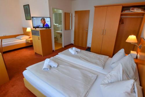 Imagen de la habitación del Hotel Motel55 - nettes mit Self Check-In in Villach, Warmbad. Foto 19