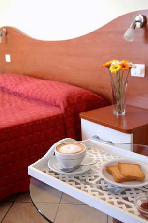 Imagen de la habitación del Hotel Motta Residence. Foto 9