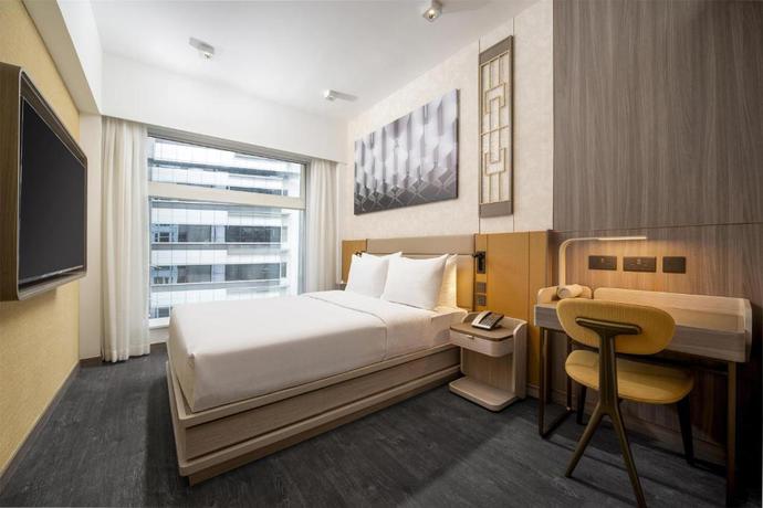 Imagen de la habitación del Hotel Motto by Hilton Hong Kong Soho. Foto 5