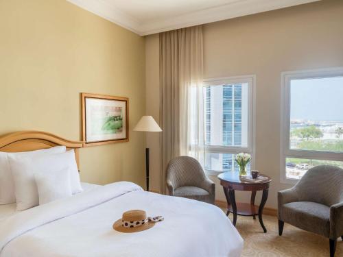 Imagen de la habitación del Hotel Mövenpick Doha. Foto 14