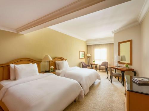 Imagen de la habitación del Hotel Mövenpick Doha. Foto 17