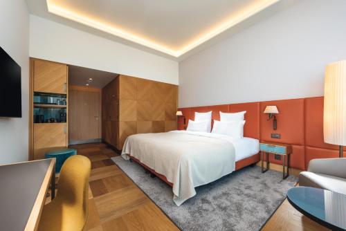 Imagen de la habitación del Hotel Mövenpick Hotel Basel. Foto 12