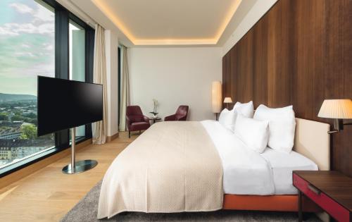 Imagen de la habitación del Hotel Mövenpick Hotel Basel. Foto 18