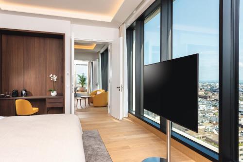 Imagen de la habitación del Hotel Mövenpick Hotel Basel. Foto 19