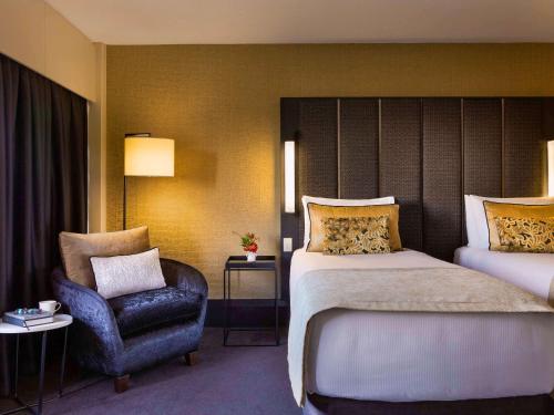 Imagen de la habitación del Hotel Mövenpick Hotel Wellington. Foto 14