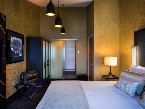 Imagen de la habitación del Hotel Mövenpick Hotel Wellington. Foto 19