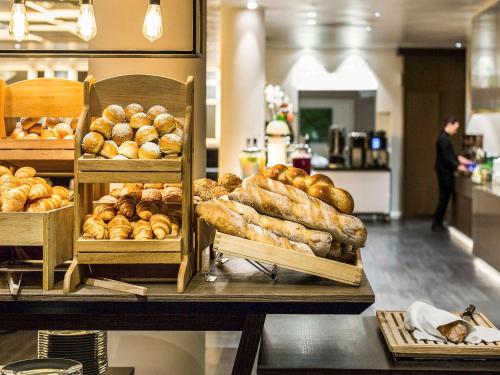 Imagen del bar/restaurante del Hotel Mövenpick Lausanne. Foto 7