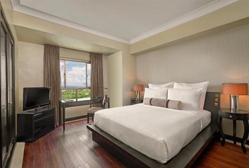 Imagen de la habitación del Hotel Mövenpick Mactan Island Cebu. Foto 11