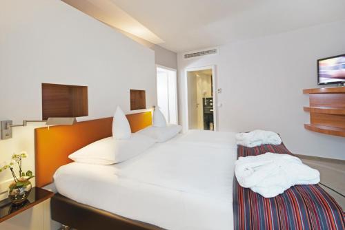 Imagen de la habitación del Hotel Mövenpick Münster. Foto 15