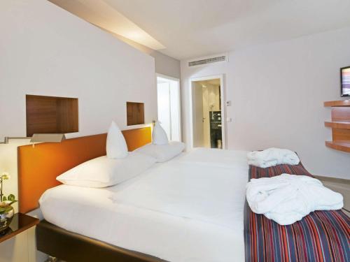 Imagen de la habitación del Hotel Mövenpick Münster. Foto 16