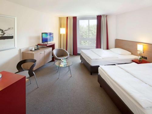 Imagen de la habitación del Hotel Mövenpick Münster. Foto 18