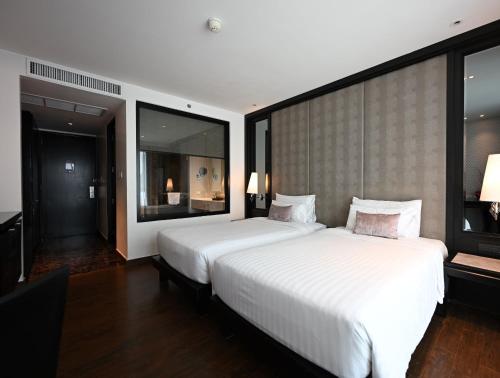 Imagen de la habitación del Hotel Mövenpick Sukhumvit 15 Bangkok. Foto 18