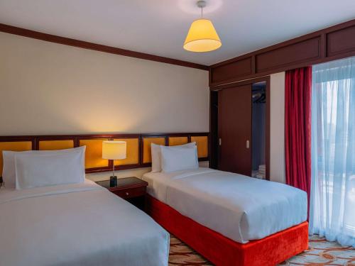 Imagen de la habitación del Hotel Mövenpick and Residences Nairobi. Foto 13