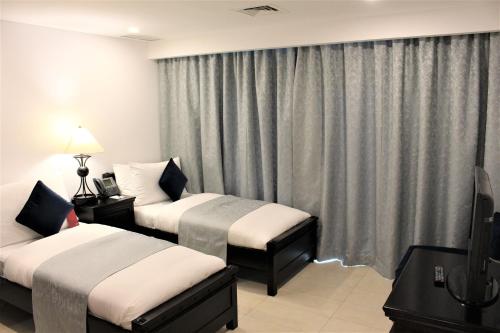 Imagen de la habitación del Hotel Mövenpick and Resort Al Bida'a Kuwait. Foto 20
