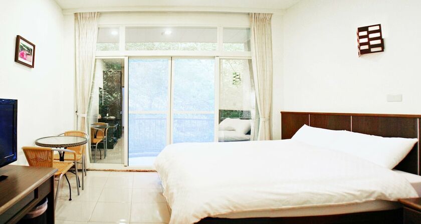 Imagen de la habitación del Hotel Mountain Lodge, Jialun. Foto 15
