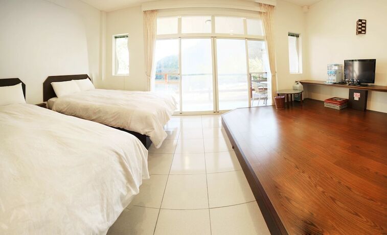 Imagen de la habitación del Hotel Mountain Lodge, Jialun. Foto 18