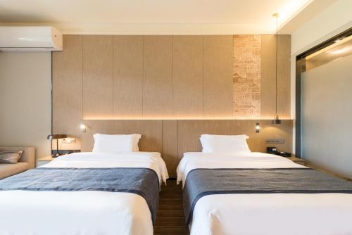 Imagen de la habitación del Hotel Mountain Tree Huizhou Longmen. Foto 16