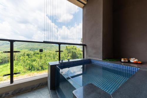 Imagen de la habitación del Hotel Mountain Tree Huizhou Longmen. Foto 17