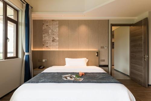 Imagen de la habitación del Hotel Mountain Tree Huizhou Longmen. Foto 20