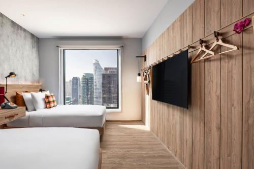 Imagen de la habitación del Hotel Moxy Bangkok Ratchaprasong. Foto 2