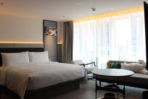 Imagen de la habitación del Hotel Moxy Chongqing. Foto 11