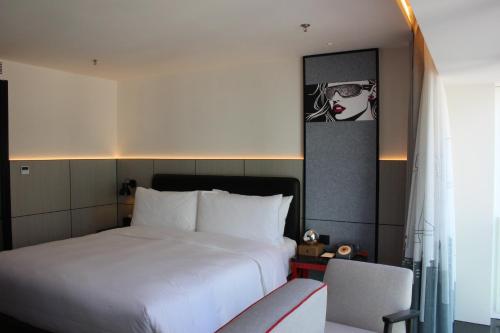 Imagen de la habitación del Hotel Moxy Chongqing. Foto 12